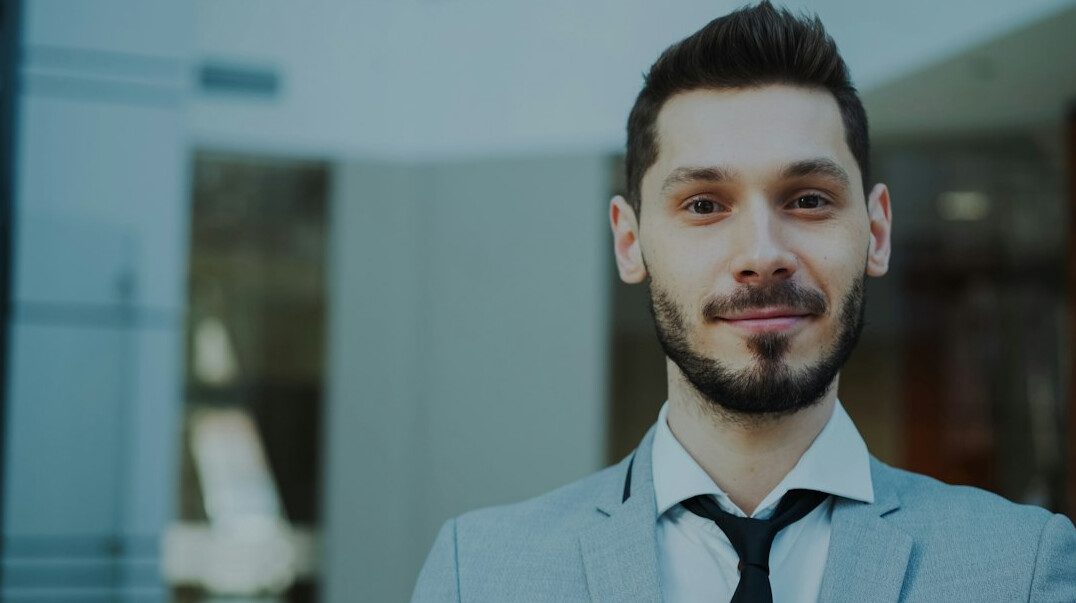 man in business suit speaking