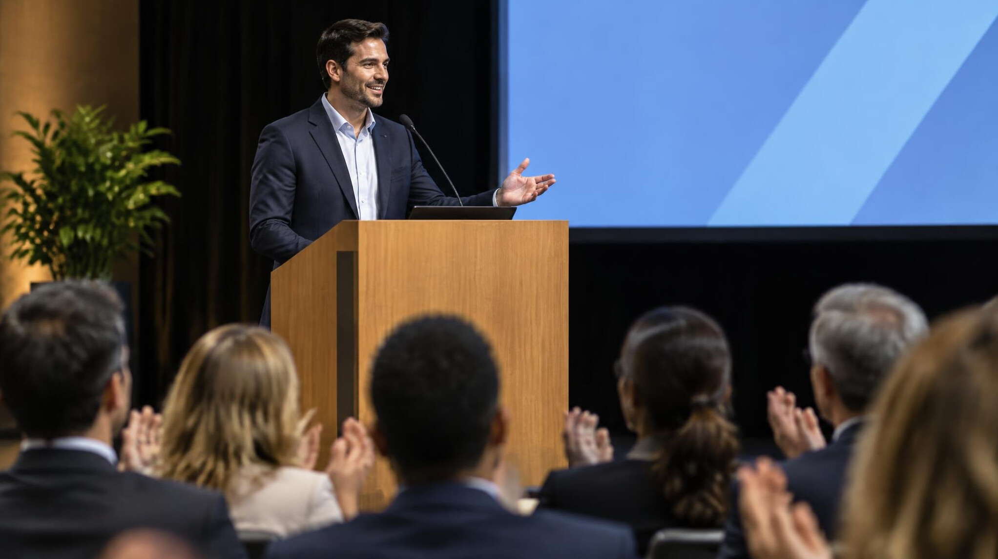 man speaking on stage